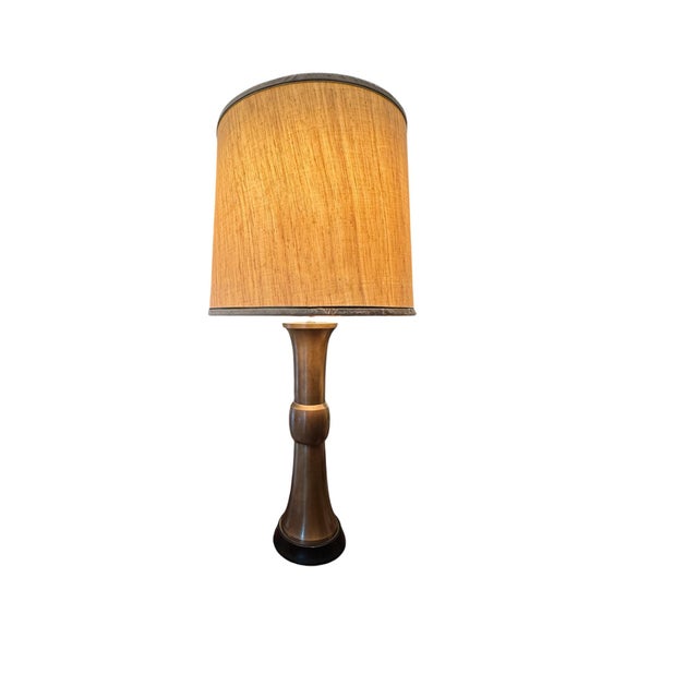 A stunning iteration of James Mont's Gu form lamps. Formed in brass with lacquered wood base. A very sturdy size lamp for...