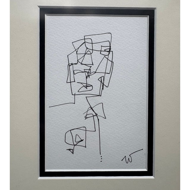 Strong lines in complex figurative drawings in ink on heavy cream paper double-matted in black and cream under gallery...