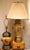 This pair of Chapman Manufacturing table lamps is gorgeous in rich tan with leather and a brass pedestal base. The lamps...