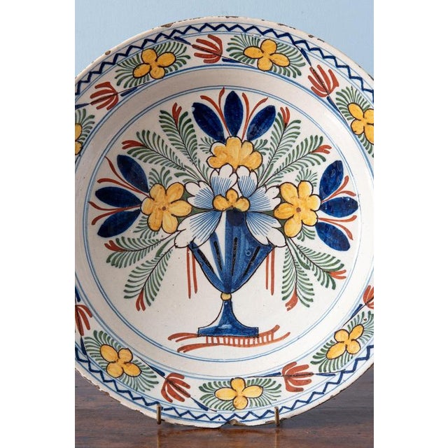 Diameter: 30.5 cm Height: 5 cm A chip and some glaze losses to the edge.