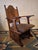 Gothic revival armchair in carved solid oak, wool-covered seat, dating from about 1910. Beautifully patinated oak.