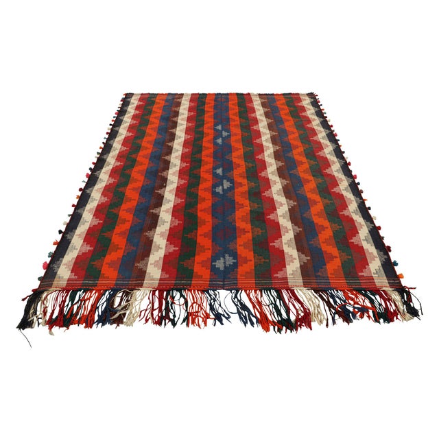 Handwoven in wool, circa 1950-1960, this 6x7 vintage Turkish kilim, is a collectible piece featuring polychromatic...