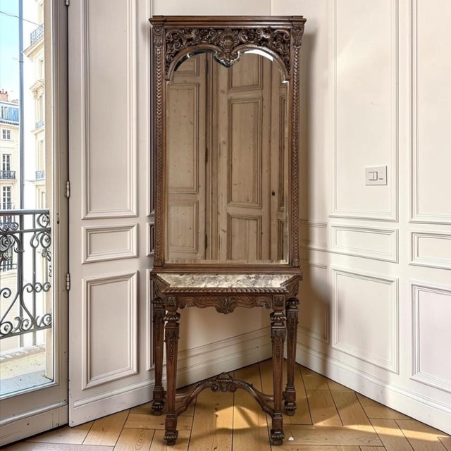 More than a console and mirror, this remarkable French creation is a complete work of cabinetmaking, carving, stonework,...
