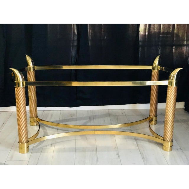 I’m pleased to offer for sale this Fabulous Italian brass table with faux elephant tusk in the style of Tommaso Barbi...