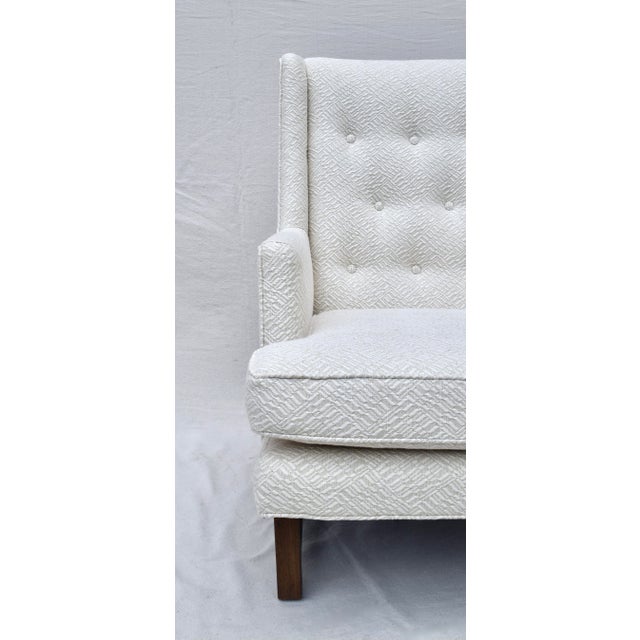 A classic 1950s Wingback Lounge arm chair by Edward Wormley for Dunbar fully restored with new textured cotton upholstery....