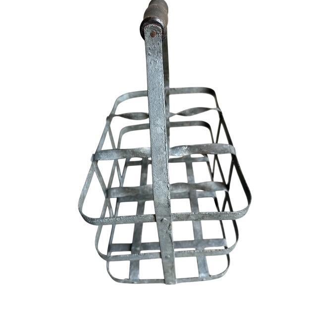 French bottler carrier. Zinc basket with wood handle holds 6 bottles. Wine bottles not included