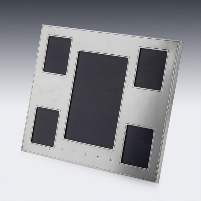 A 20th century english solid silver photograph frame of rectangular form. The understated yet distinctive design...