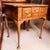 A petite ca. 1710 walnut lowboy with an exceptionally fine top of book matched and highly figured burlwood, further...