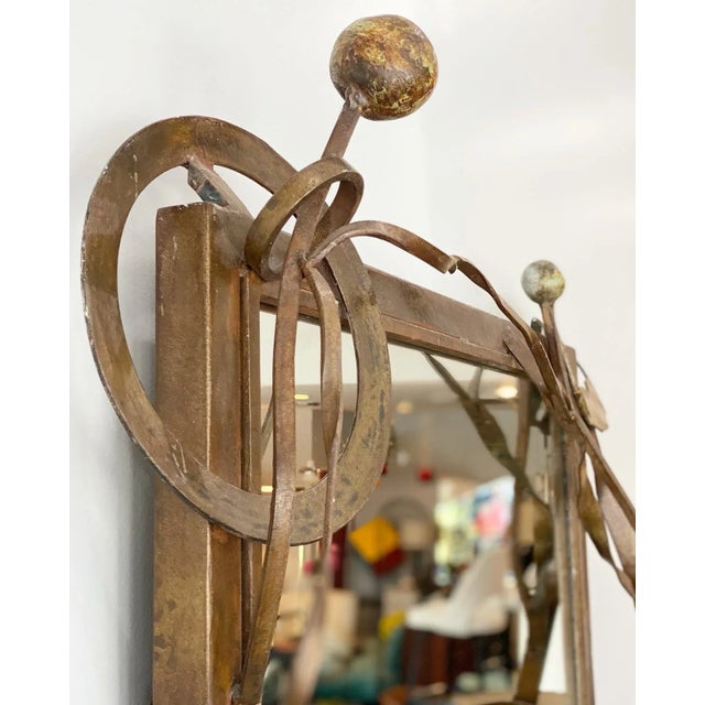 Really beautiful solid hand foraged steel mirror here with the coolest abstract design. Extremely well made and unique,...