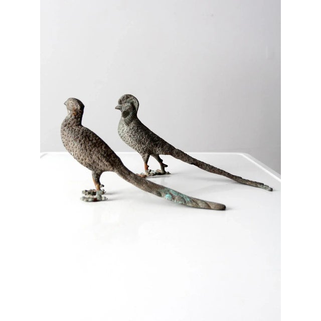A handsome pair of vintage tabletop pheasant figurines crafted in metal with exceptional detailing throughout. The...