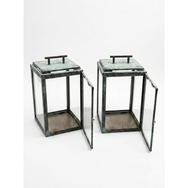 This striking pair of vintage lanterns features a clean-lined, minimalist silhouette that bridges the gap between classic...