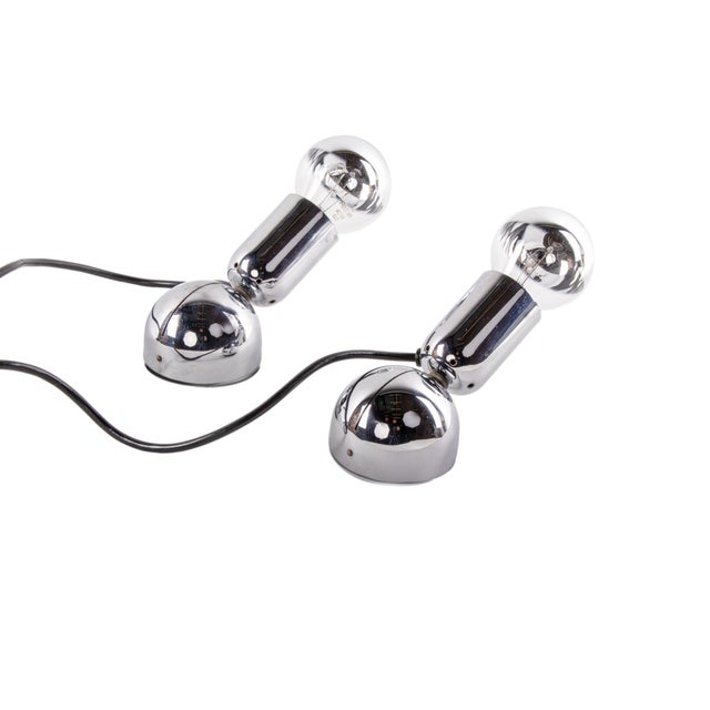 Elegant pair of minimalist adjustable chromed wall sconces and table lamps. Model 'pollux' designed 1967 by ingo maurer,...