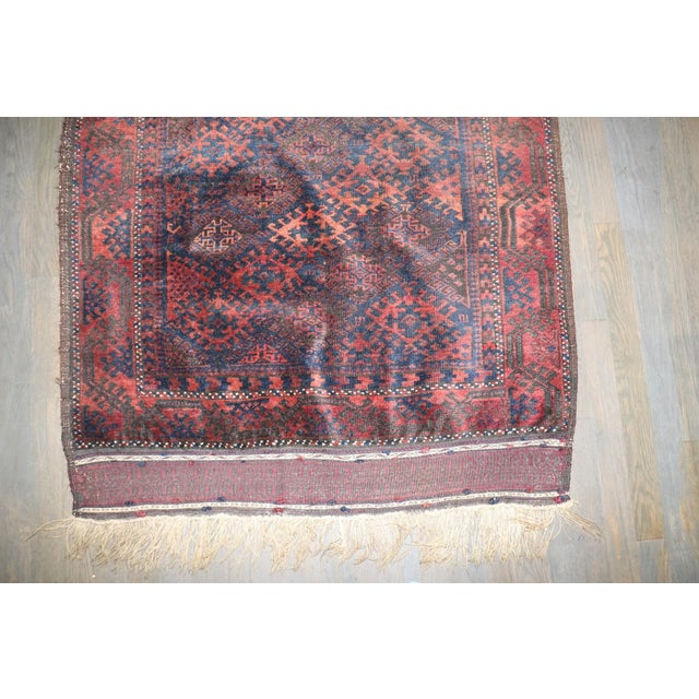 a 1920s Balouch scatter size rug