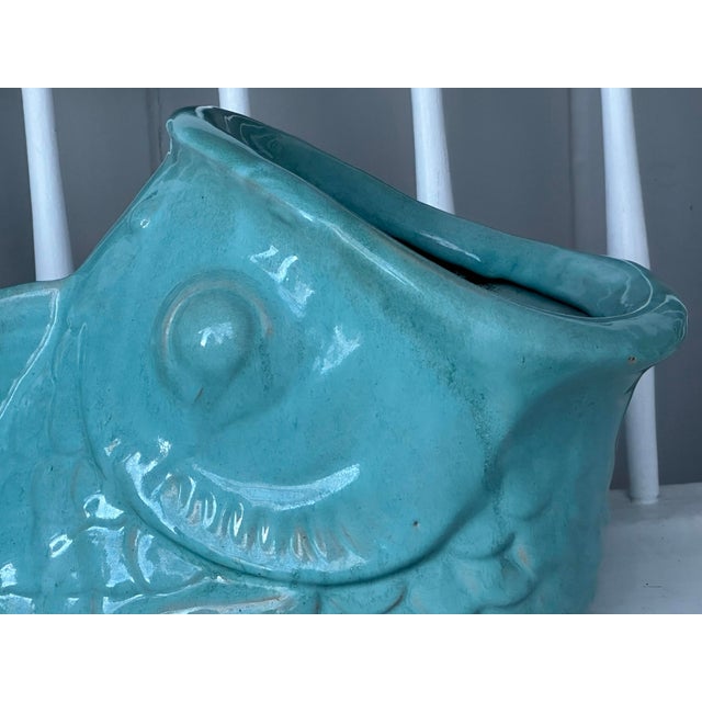 This is a fun ceramic Koi Fish planter with a rich turquoise glaze, broad rounded rim and central drainage hole for proper...