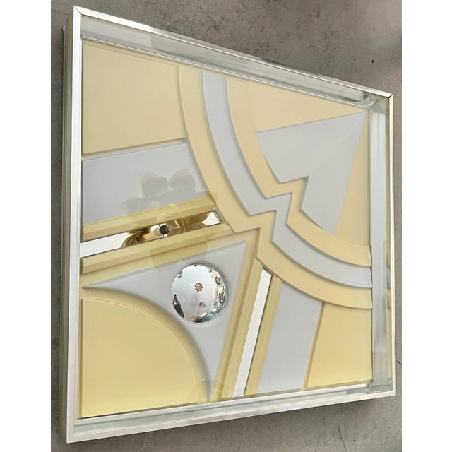 Art Deco style wall panel by Turner. Three dimensional geometric design. Made of white and cream plastic with mirror...