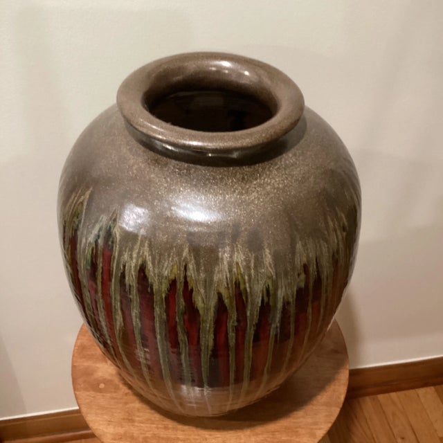 A unique vintage piece in a rare condition... not to be missed. A true stunner! The vase is made of red clay and has a...