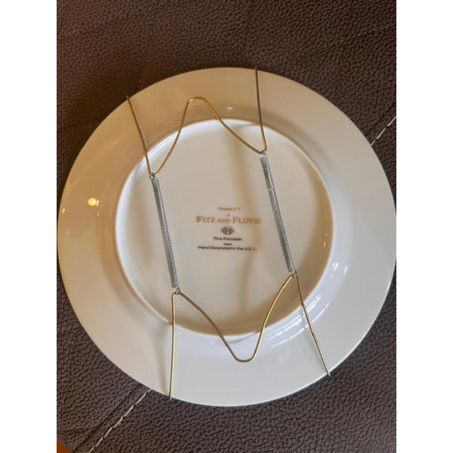 This set features vintage Fitz and Floyd collector plates from the Chaise series, known for their elegant, hand-decorated...