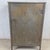 A striking example of rugged utilitarian design, this vintage industrial metal storage cabinet brings a bold factory...
