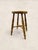A charming antique English milking stool crafted from solid elm, featuring a beautifully worn circular seat, hand-turned...