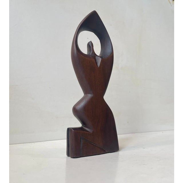 Tactile and organically hand-carved/tooled figurine of a kneeling praying woman. It's made from stained/oiled teak....
