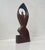 Tactile and organically hand-carved/tooled figurine of a kneeling praying woman. It's made from stained/oiled teak....
