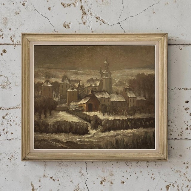 Maurice Fourneau’s “Winter Village” is a beautifully atmospheric Belgian oil painting on board depicting a historic...