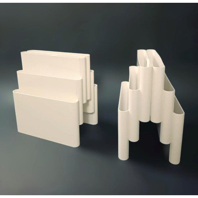 Vintage Italian mid-century white plastic magazine rack with six compartments and a round handle, designed by Giotto...