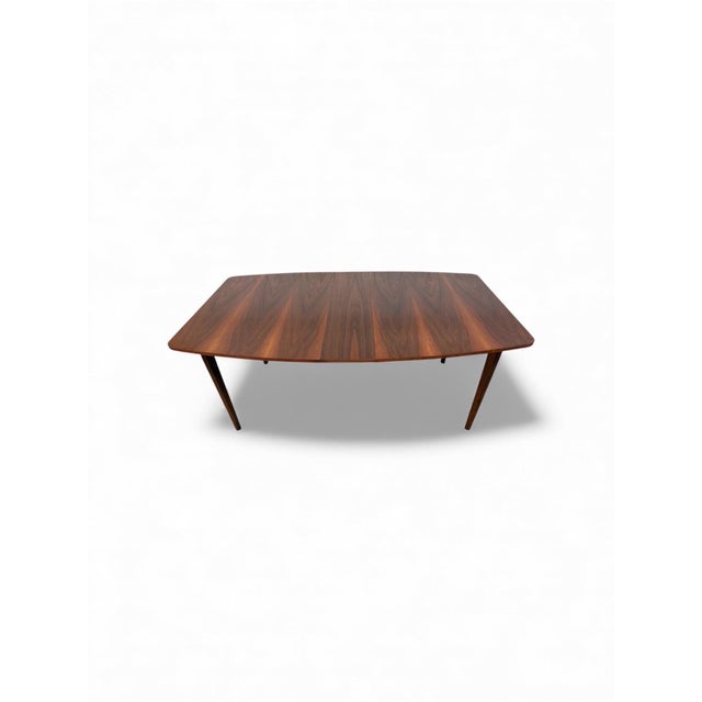 This listing is for a Mid-Century Modern Walnut Dining Table. Featuring a straight line design, rectangular walnut top,...
