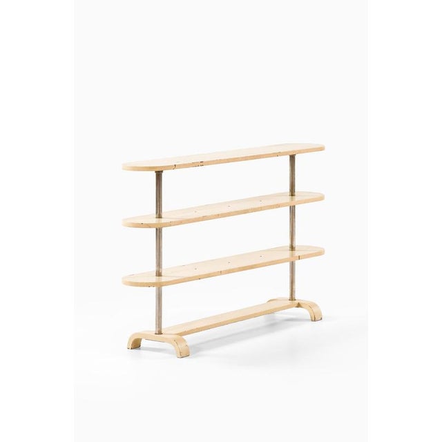 This rare side or console table, model 935, designed by axel larsson and produced by bodafors in sweden during the 1930s,...