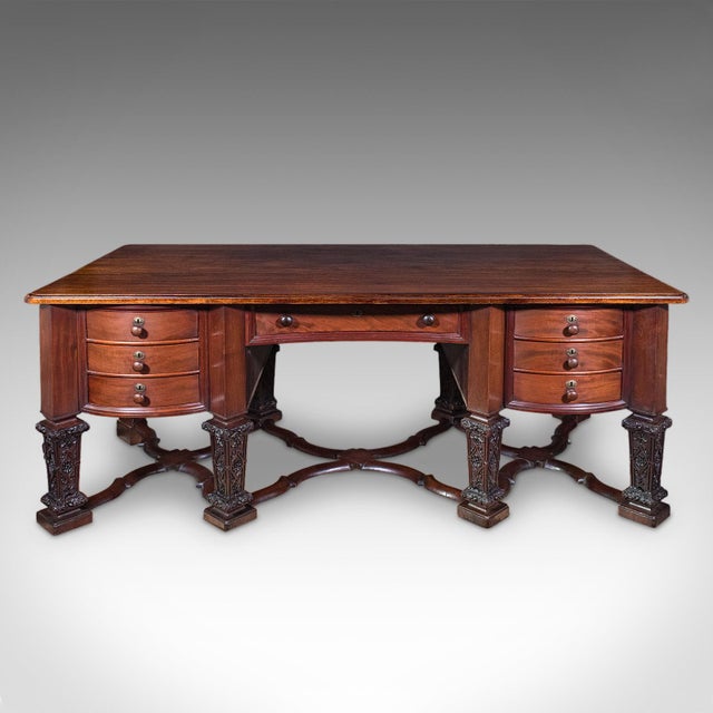 This is a large antique partner's desk. An English, mahogany bureau Mazarin in Louis XIV taste, dating to the late...