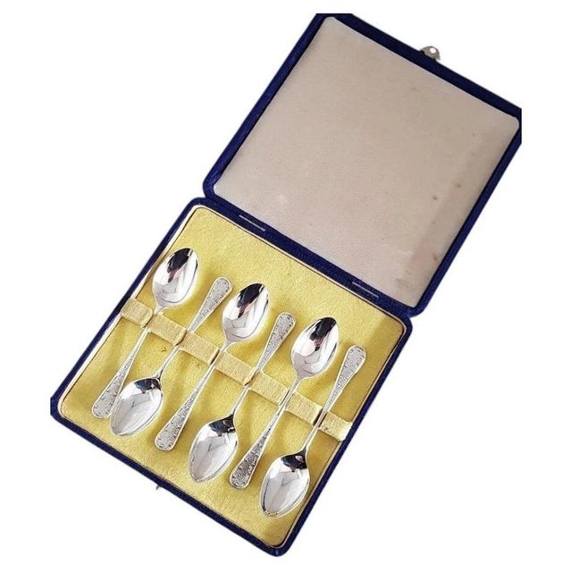 A refined set of antique english tea and coffee spoons by w & co. Ltd, crafted in solid sterling silver and hallmarked in...