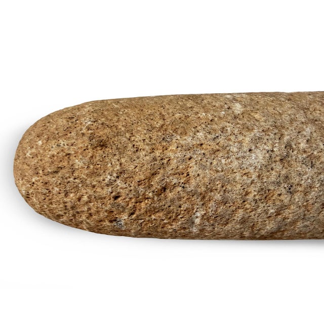 This original African stone grain pestle is a primitive utilitarian artifact once used in the traditional preparation of...