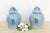 A pair like this earns its place as a room's focal point without trying hard. Each jar carries a dense, all-over floral...