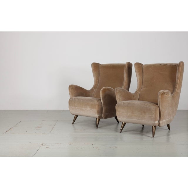 Set of two wingback chairs, designed and manufactured by I.S.A. Bergamo, Italy, 1950s Elegant mid-20th-century wingback...