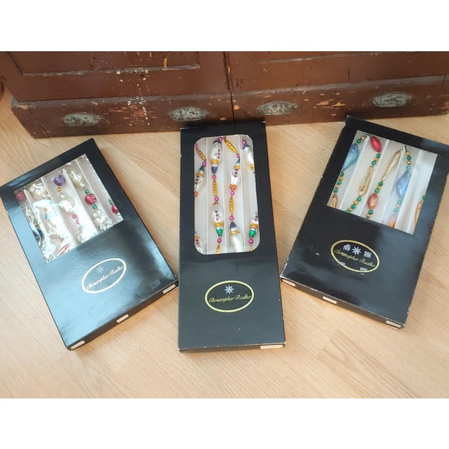 Here's a fine lot of vintage Christopher Radko glass ornament garlands in their original boxes. You have clowns (1992),...