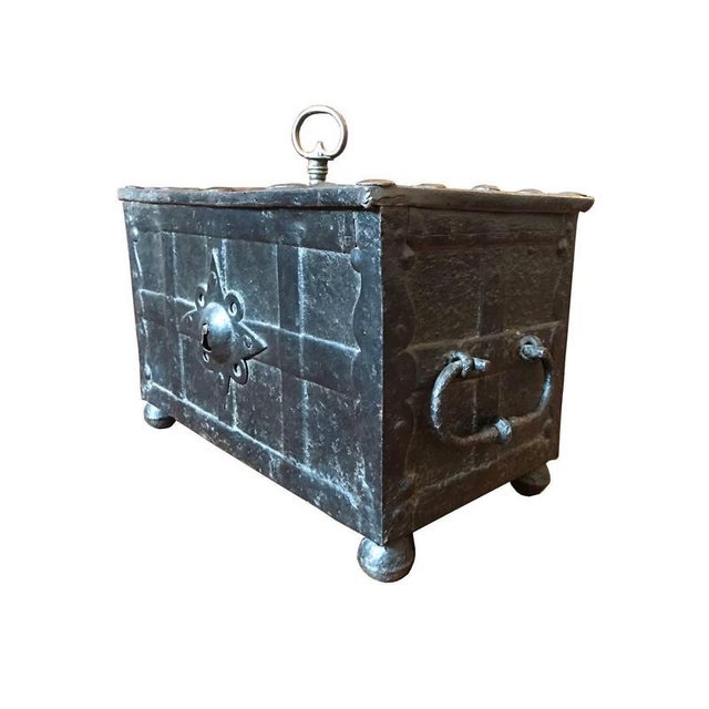 The iron coffer, fully original in every part of it, was forged and handcrafted in German in the 1610. Complete with key....