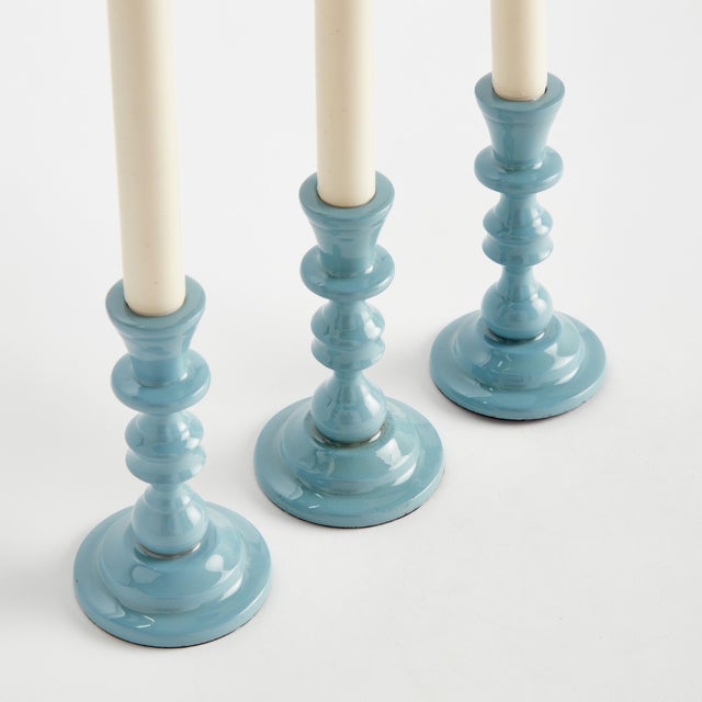 Traditional style in a contemporary fabrication, this set of taper holders is designerinspired. Made of enamel coated...
