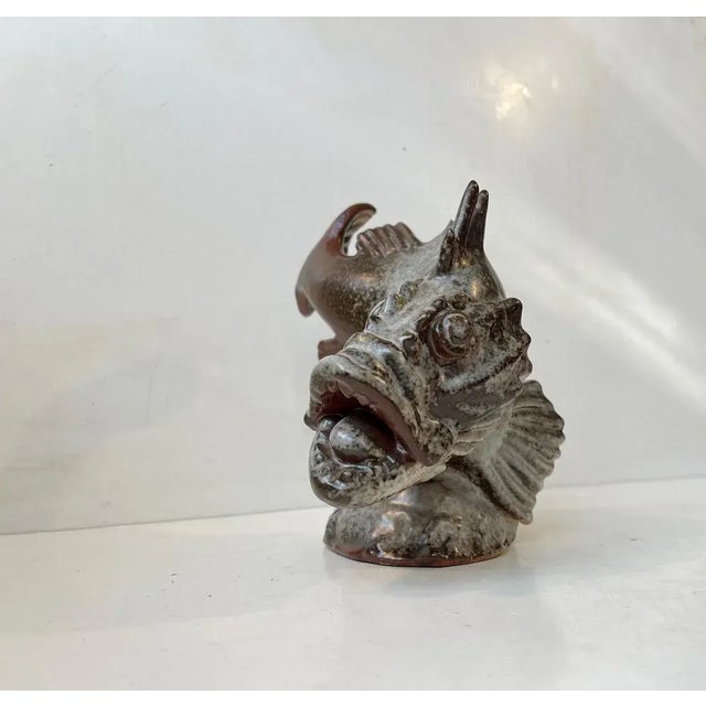 Unique fish sculpture by the renowned danish artist carl hugo liisberg. Its executed in glazed stoneware and has a rather...