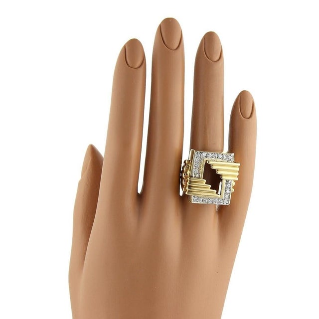 This product is an elegant Diamond 18k Yellow Gold Ring in a rectangular shape with an open top design. The ring is...