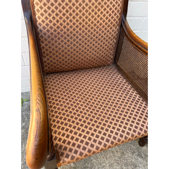 Antique Oak Bergere Armchair Featuring Barley Twist Legs, Arms, and Stretchers, With Cane Paneling Sides and Caster Wheels For Sale - Image 11 of 11