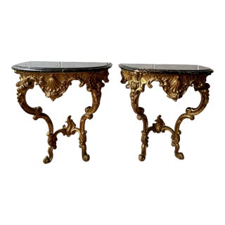 Pair Italian Rococo Revival Giltwood Wall Consoles With Black Marble Tops For Sale