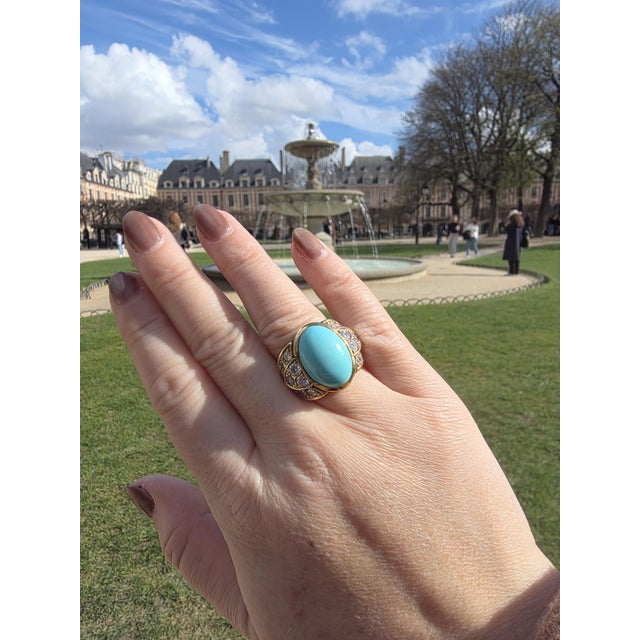 A striking mid-century Italian design, this vintage ring centers on a captivating oval turquoise cabochon in a vivid...