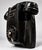This is a vintage wall-mounting rotary telephone molded in glossy black Bakelite, featuring an integrated handset cradle,...