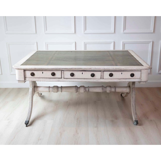A European partners desk of substantial proportions, dating to circa 1820. The desk features finely cast bronze mounts and...