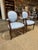 Handsome matched pair of Louis XVI style fauteuils — the classic French neoclassical open-arm chair, with finely carved...