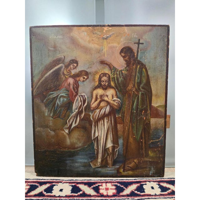Presenting a magnificent 19th-century Orthodox icon depicting Saint John Christening Jesus. This piece is painted in...