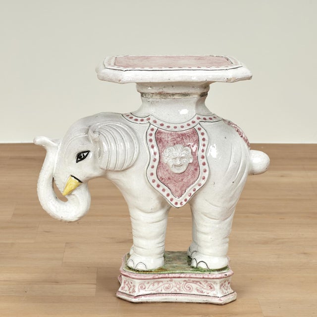 Amusing vintage Italian elephant drinks stand crafted in terra cotta, hand decorated in soft alluring colors and glazed.