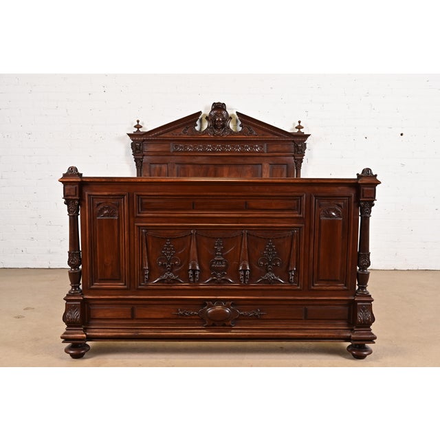 An exceptional antique French Renaissance Revival full size bed frame In the manner of R.J. Horner & Co. France, Circa...