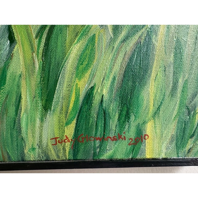A signed painting of red poppies in field.