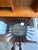 Graphic, sculptural, and sharp against light walls, this black sunburst round wall mirror works well as a functional or...